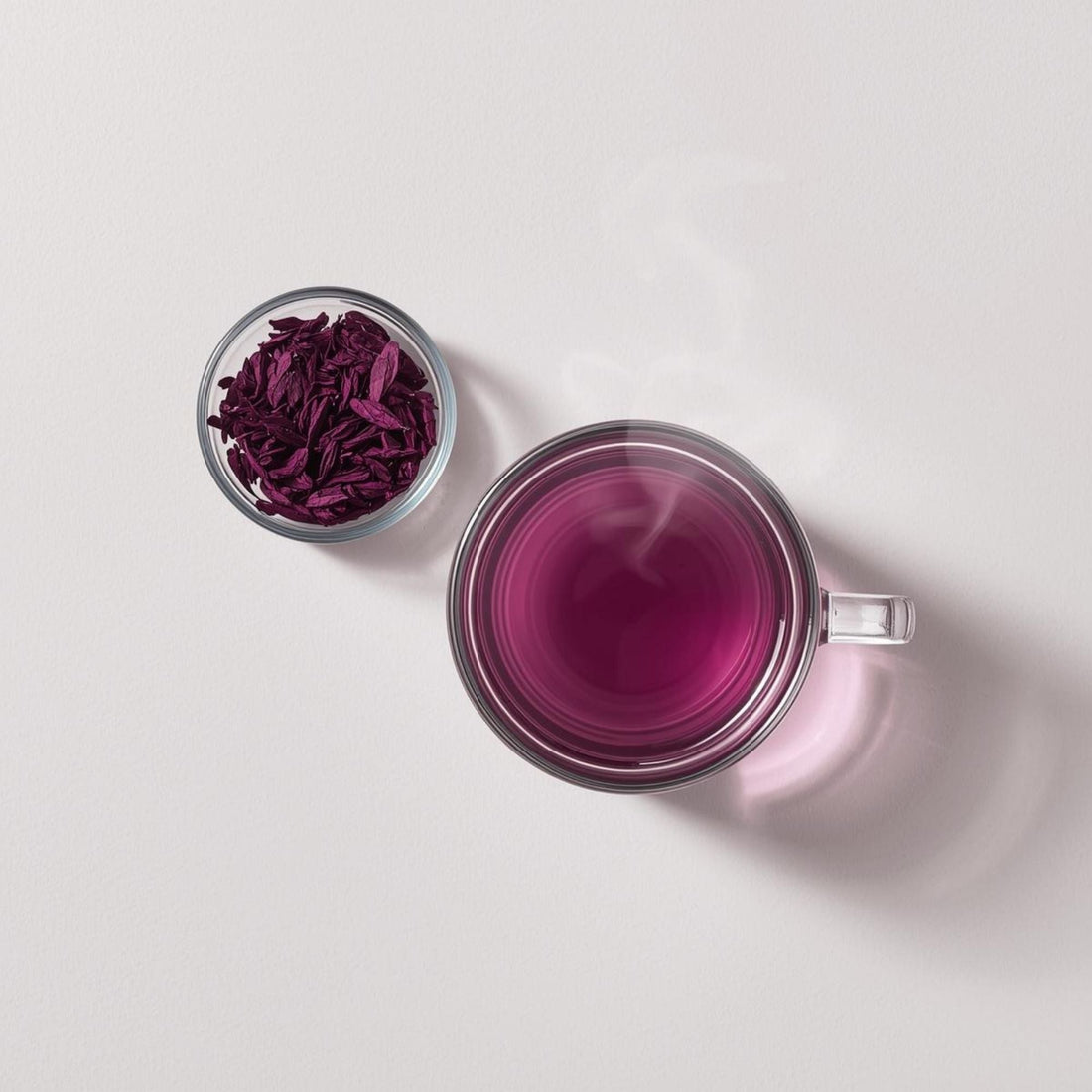 freshly brewed purple tea in clear glass cup