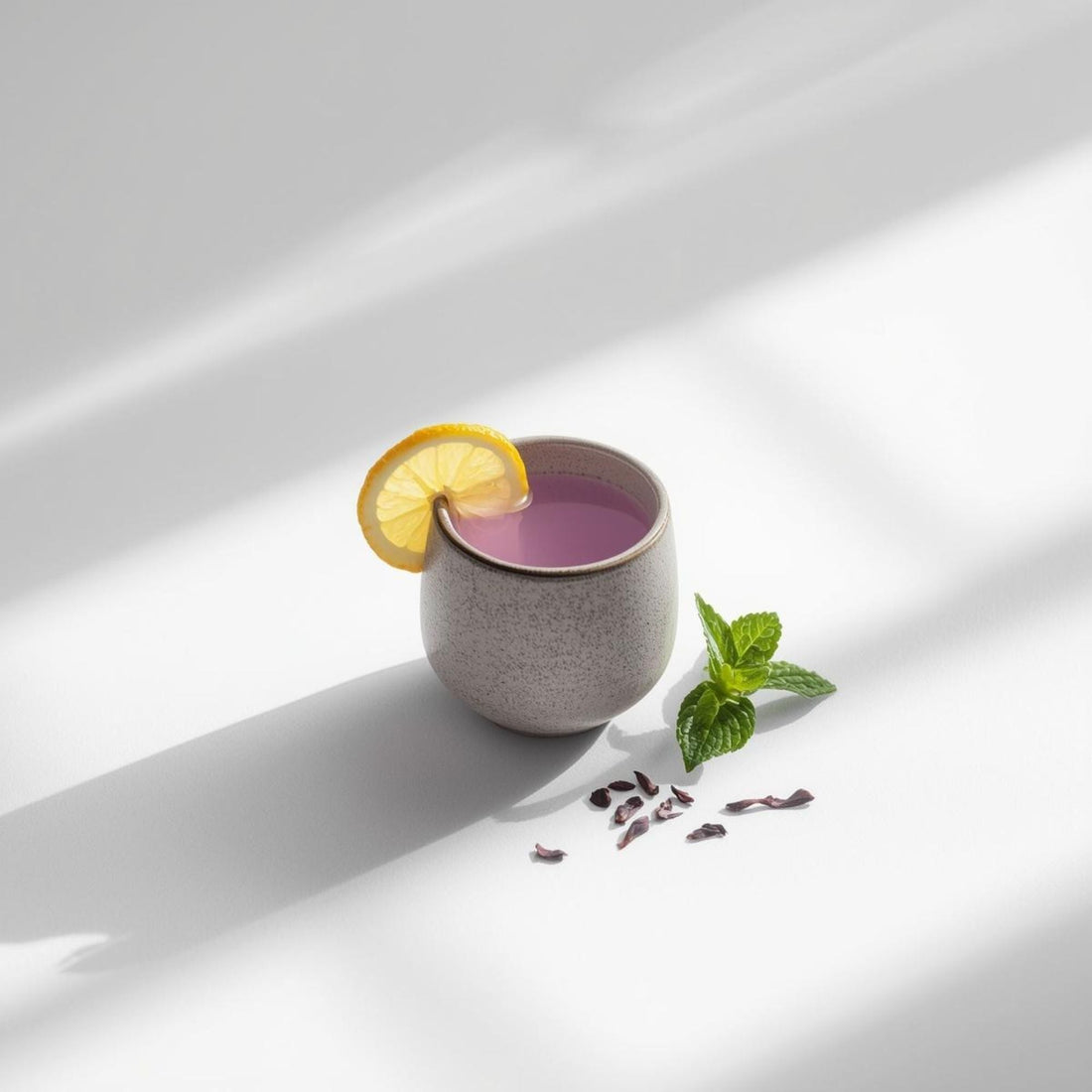 cup of purple tea in minimalist wellness setup